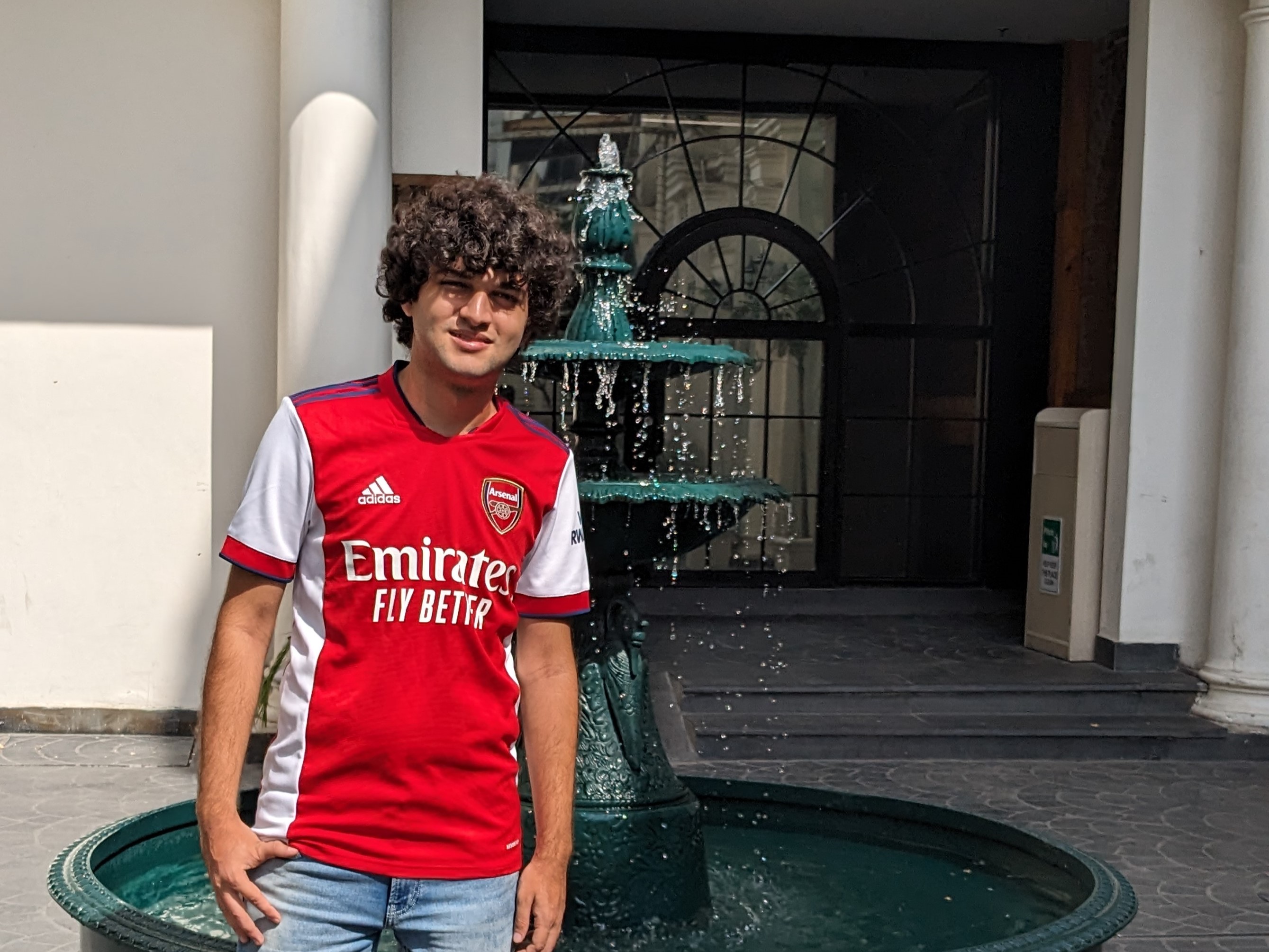 Picture of Muneeb Ahmad in an Arsenal Football Club Home Jersey.